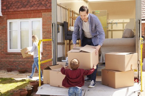 Careful wrapping of fragile household items during a local packing service