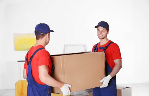 Furniture removals team handling heavy household items in Abbeywood