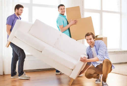 Packed boxes and furniture ready for removal van transport