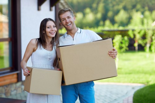 Removal team handling furniture during a house move