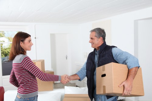 Assorted moving cartons, tape, and protective wrapping for a home move