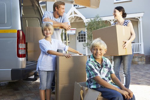 Professional movers loading furniture for an Abbeywood relocation